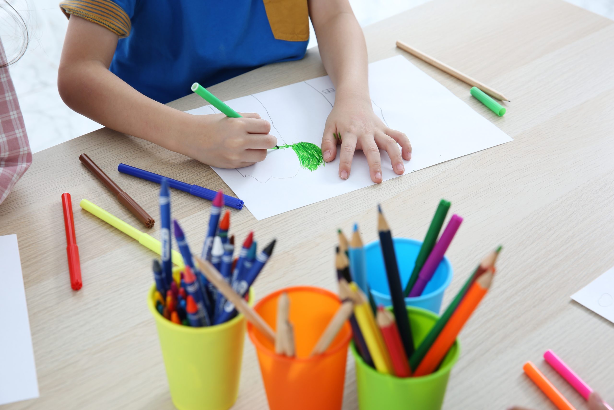 Together Asian preschool student do homework by drawing by a color, this image can use for group study, school, kid, student and education concept.